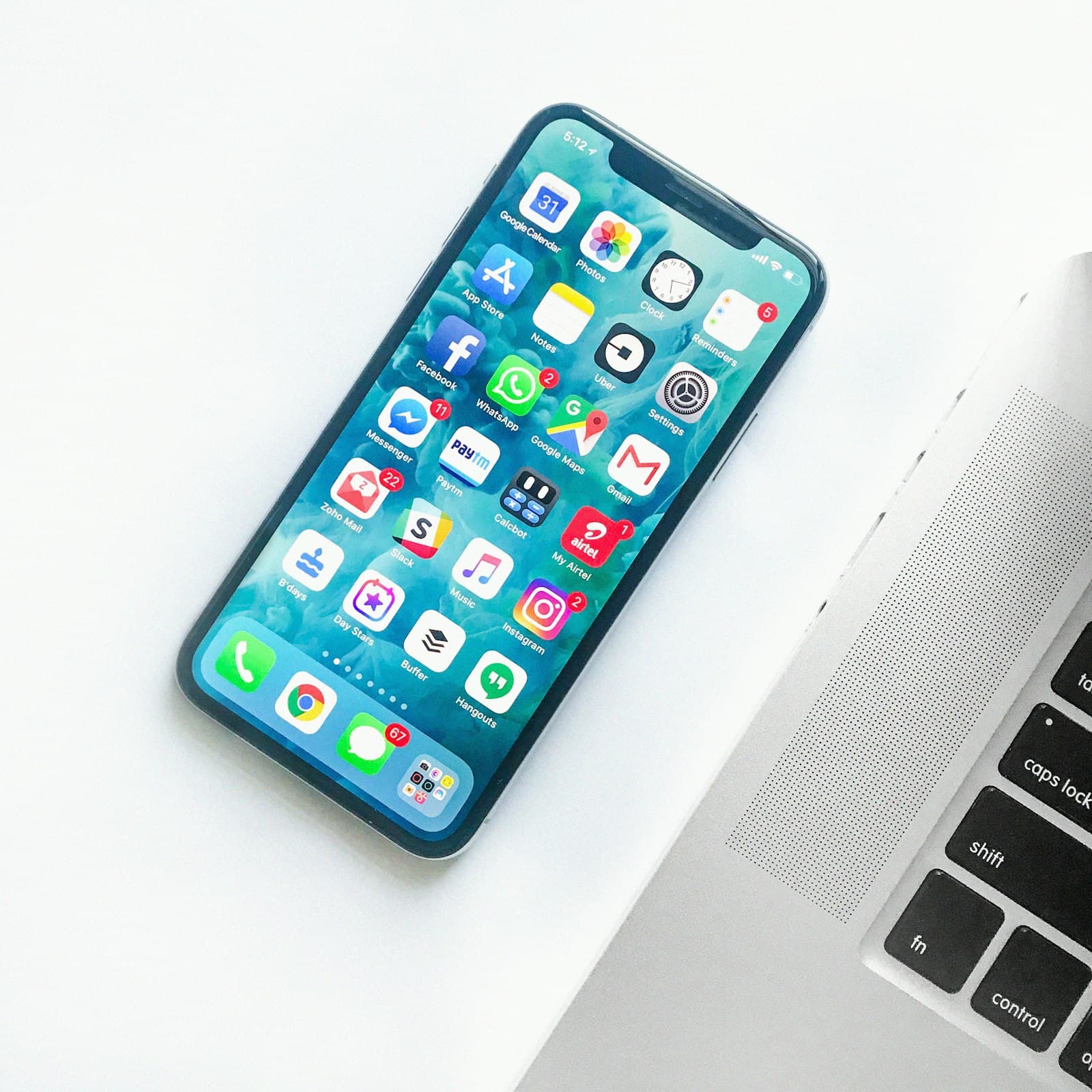 Smartphone held against a colorful background