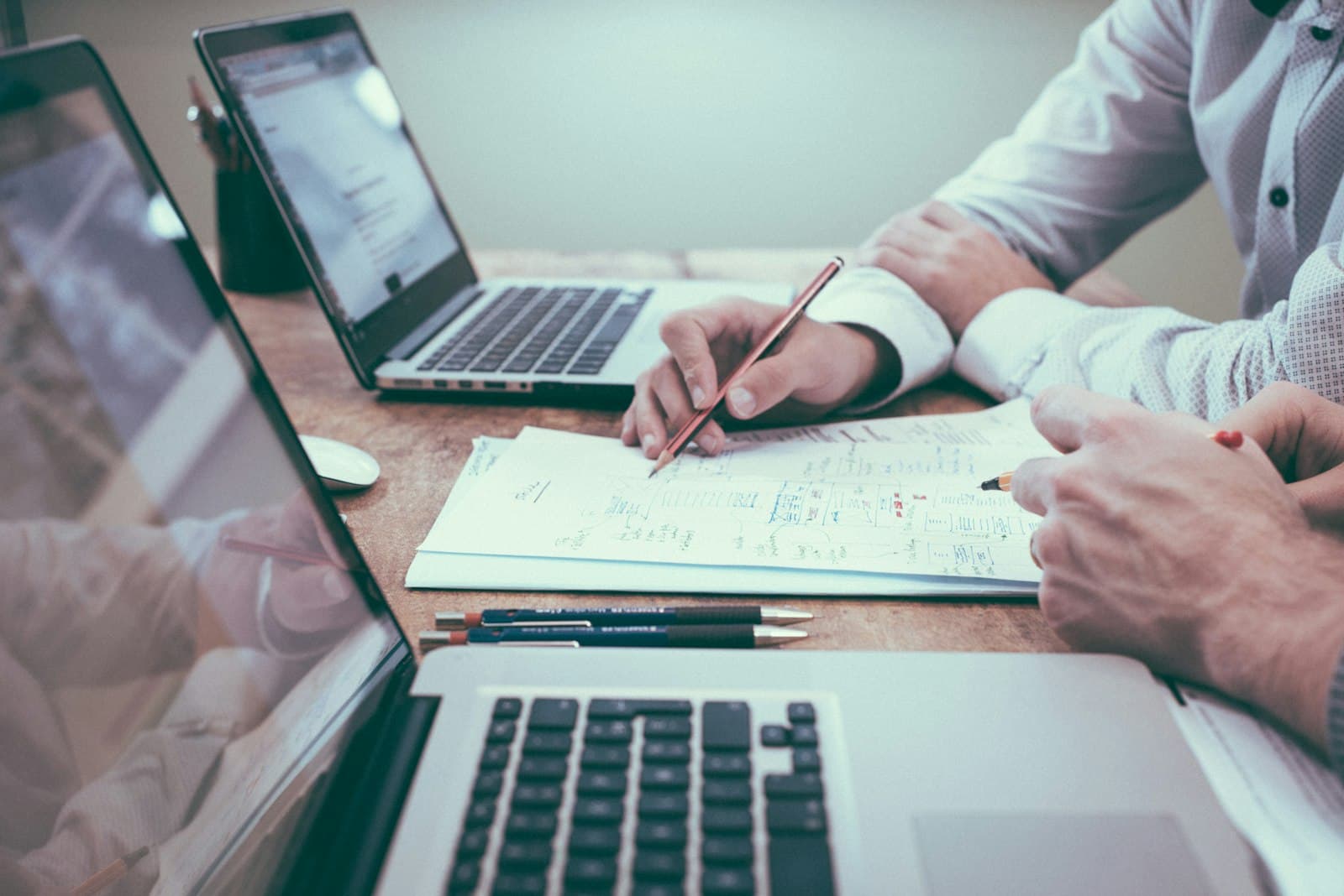Person planning work on a desk